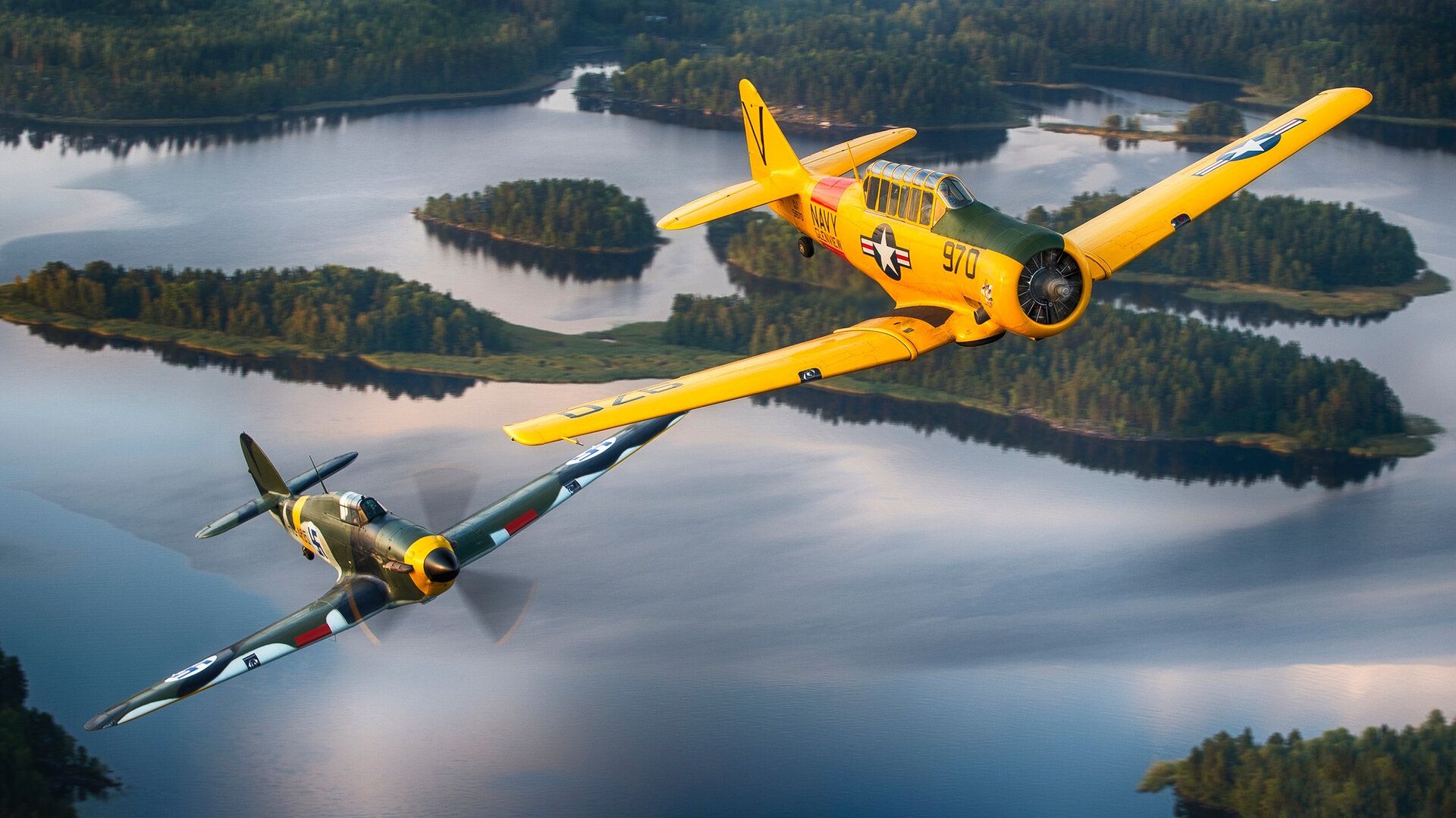 Finnish_Air_Force_Hawker_Hurricane_warbird_and_US_Navy_T-6_Texan_warbird_in_flight_over_Finland.jpg